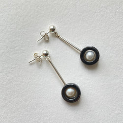 Sterling Silver earrings with round post and a ring of hematite with a small freshwater pearl. Joanna Salmond Jewellery